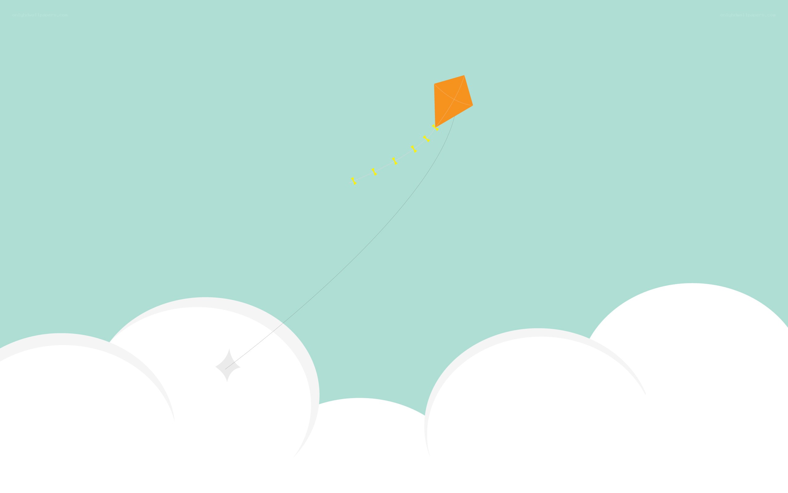 orange kite flying in sky