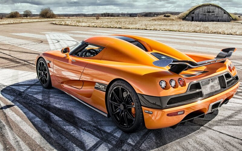 Orange Koenigsegg CCXR on airstrip