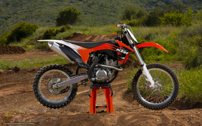 Orange KTM dirt bike on stand