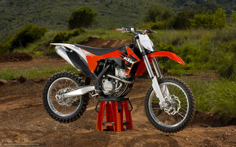 Orange KTM dirt bike on stand