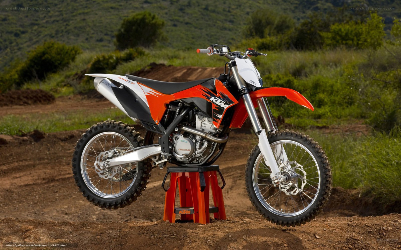 Orange KTM dirt bike on stand