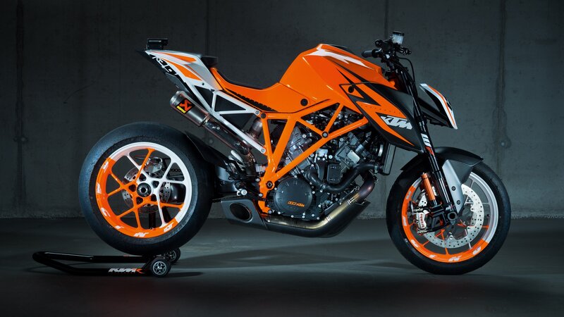 Orange KTM Motorcycle — Dramatic, Photograph, Concrete Wall