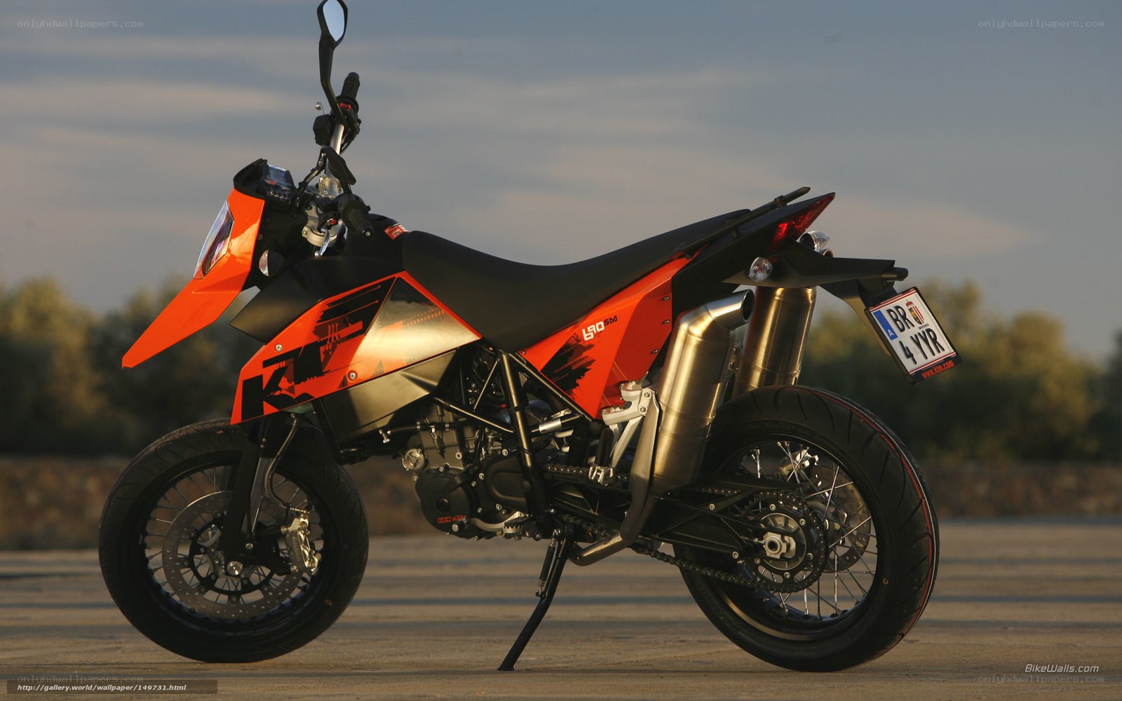 Orange KTM motorcycle on pavement