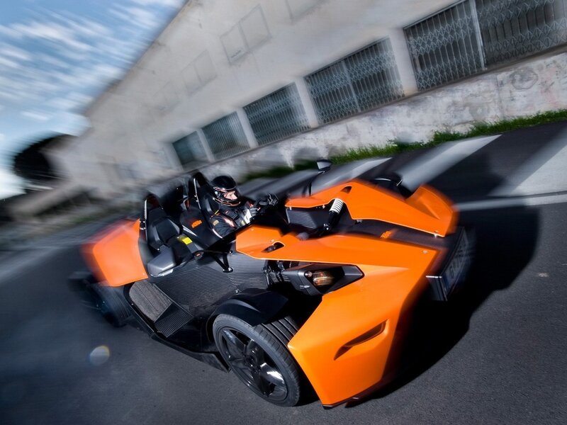 Orange KTM X-Bow in motion