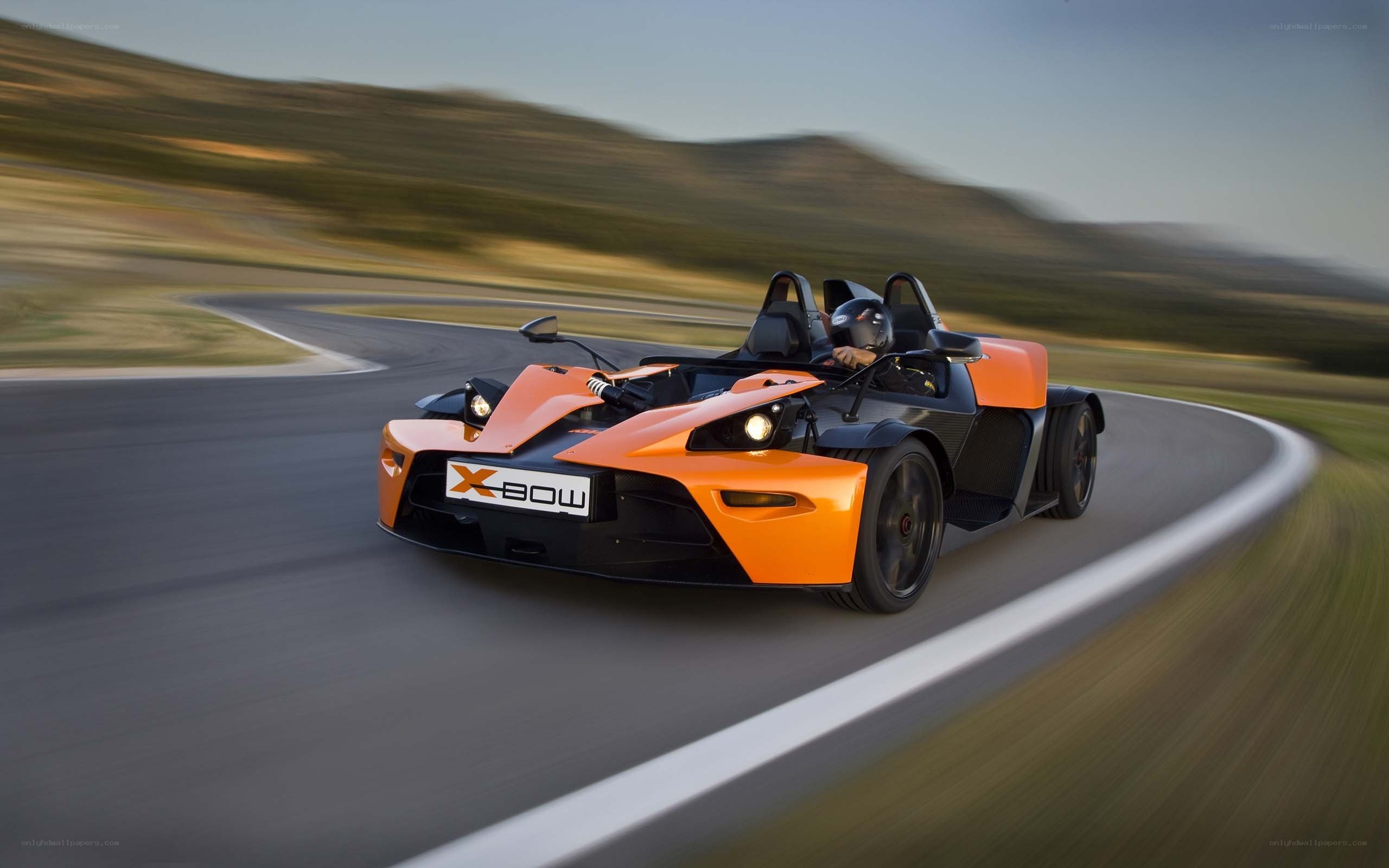 Orange KTM X-Bow on a racetrack