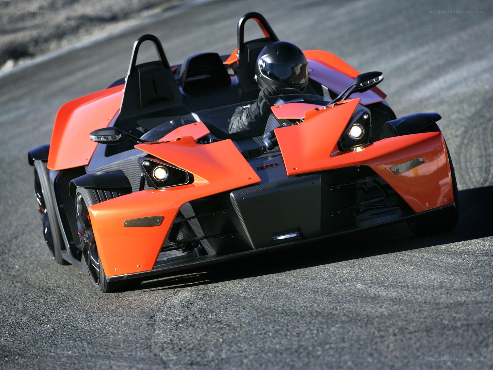 Orange KTM X-Bow on a racetrack