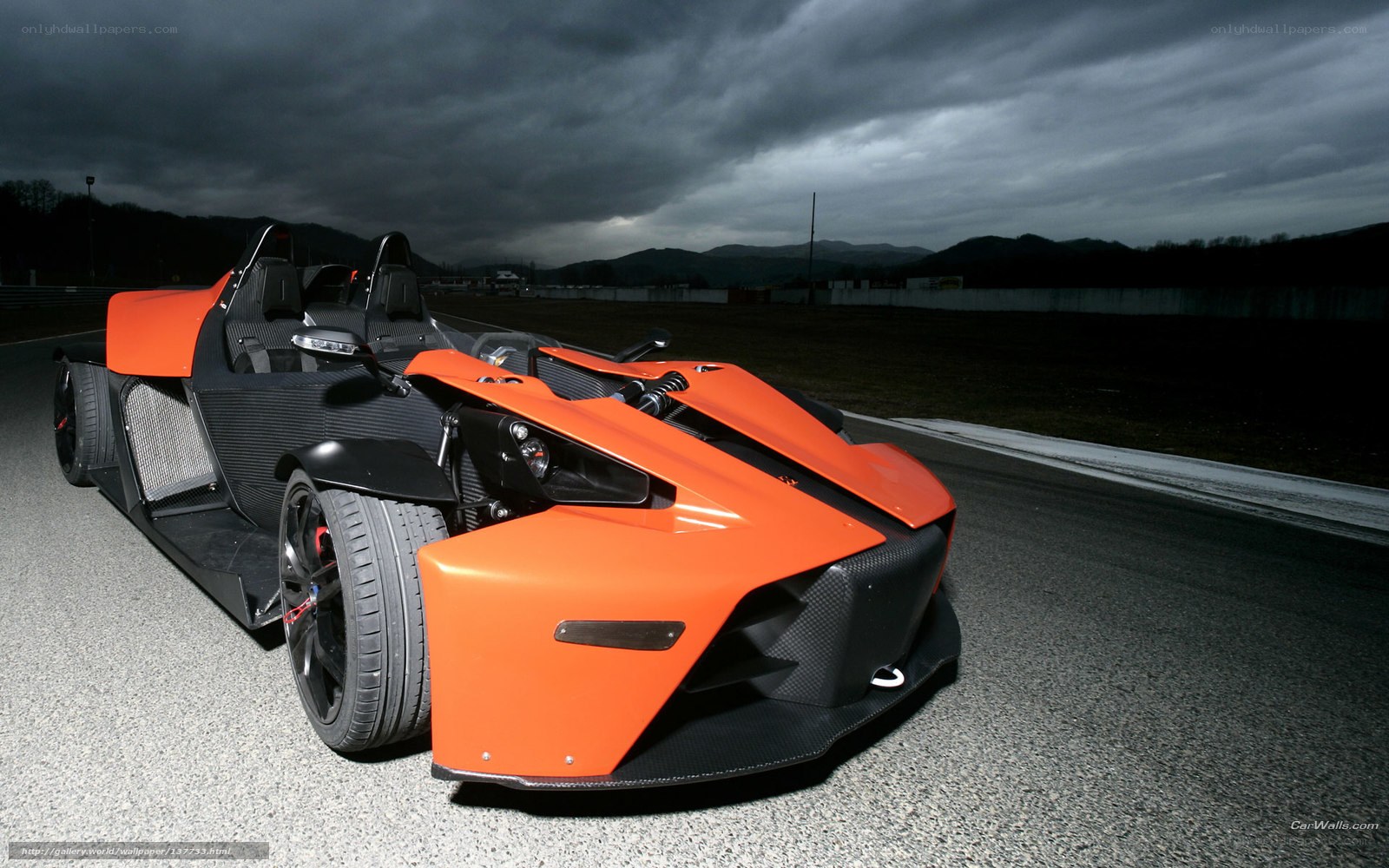 Orange KTM X-Bow on racetrack