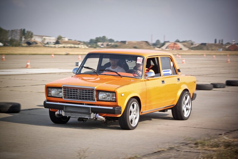 Orange Lada on a racetrack