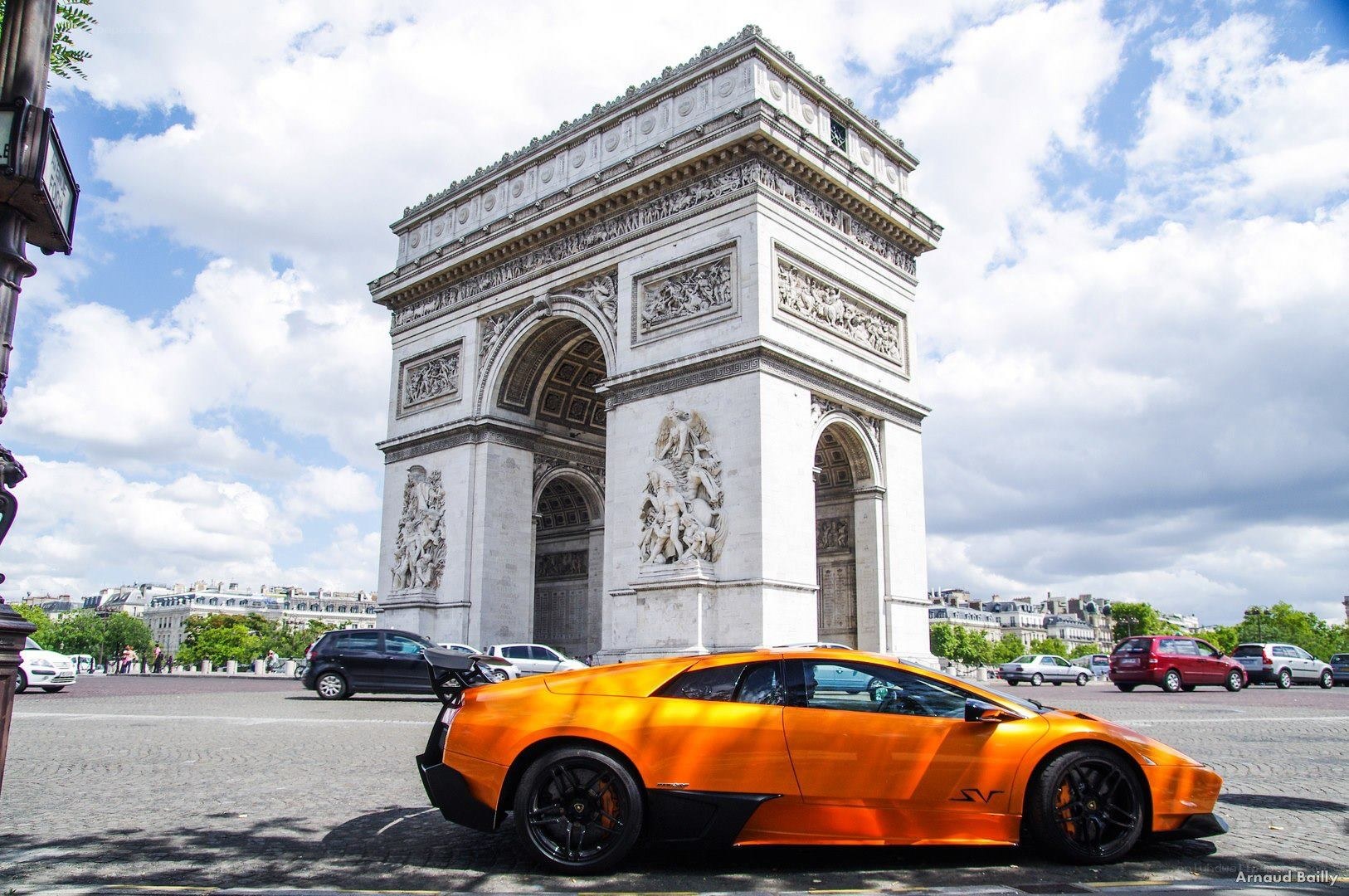 Orange Lamborghini at Arc de Triomphe