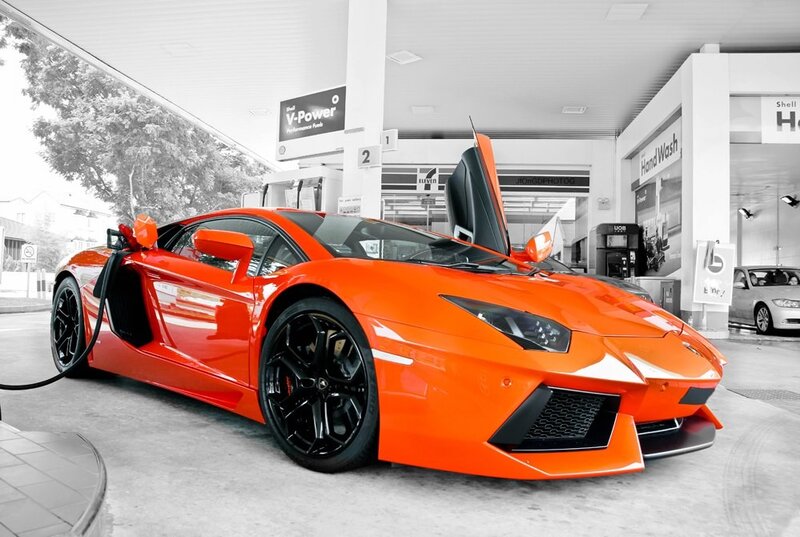 Orange Lamborghini at gas station