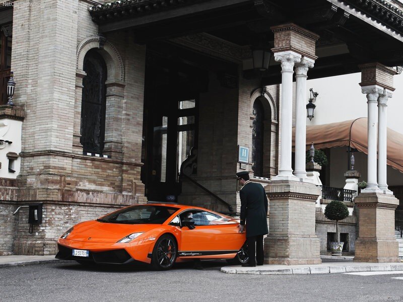 Orange Lamborghini at hotel entrance