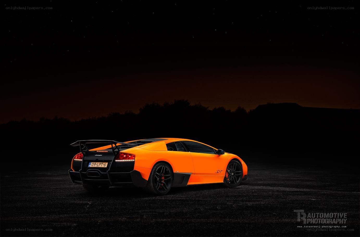 Orange Lamborghini at night