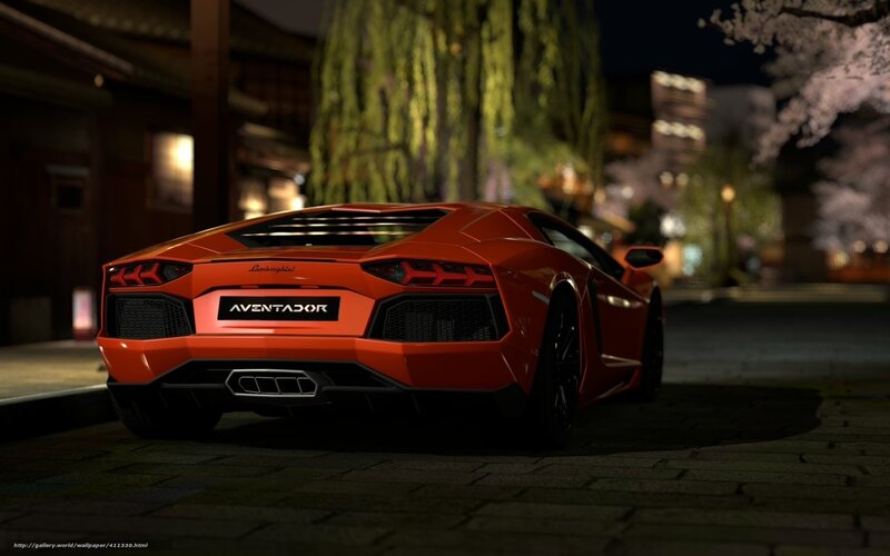 Orange Lamborghini Aventador at night