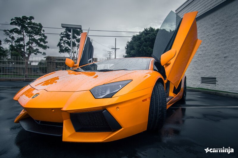Orange Lamborghini Aventador — Dramatic, Photograph, Car Door, Wet Pavement