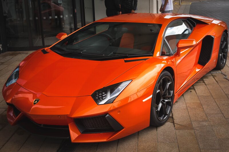 Orange Lamborghini Aventador — Dramatic, Photograph, Car, People