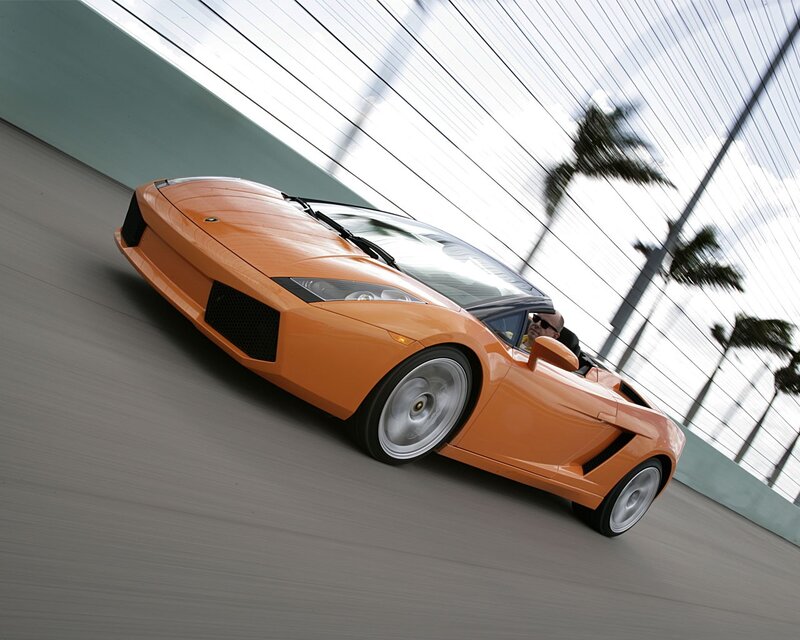 Orange Lamborghini convertible in motion