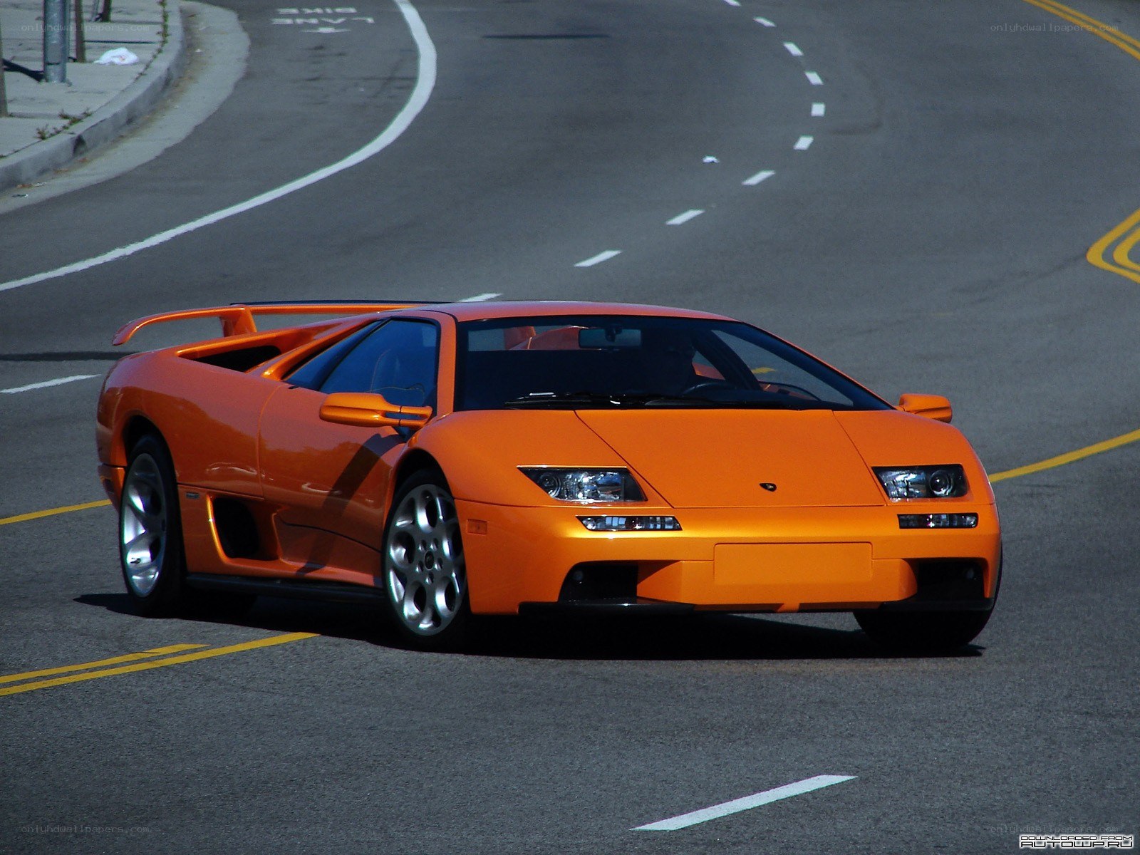 orange Lamborghini Diablo on road