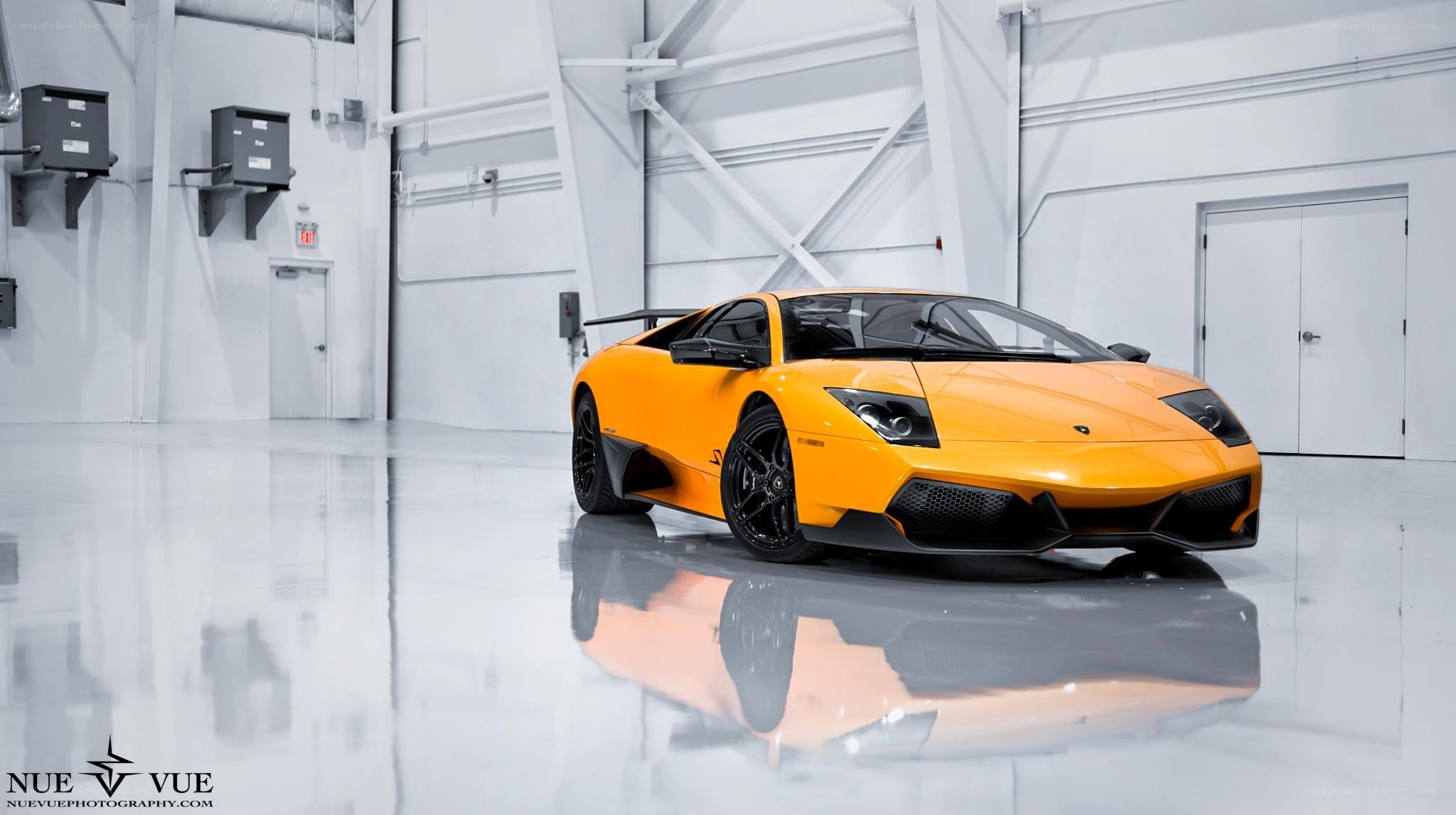 Orange Lamborghini in a garage