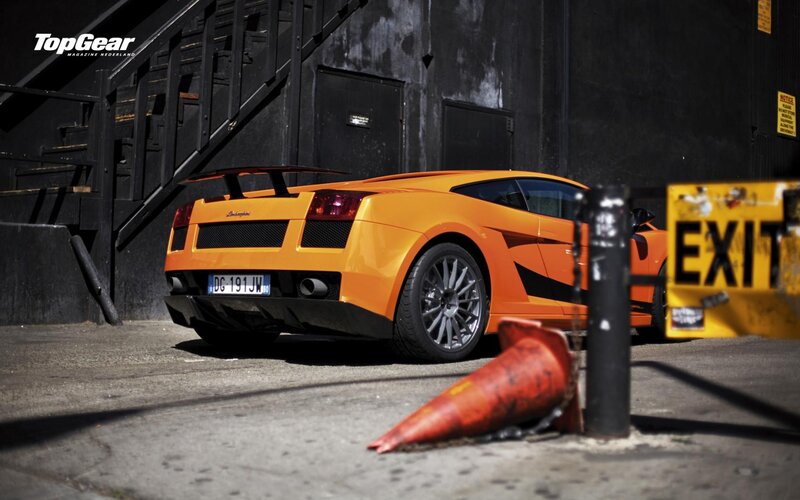 Orange Lamborghini in alley