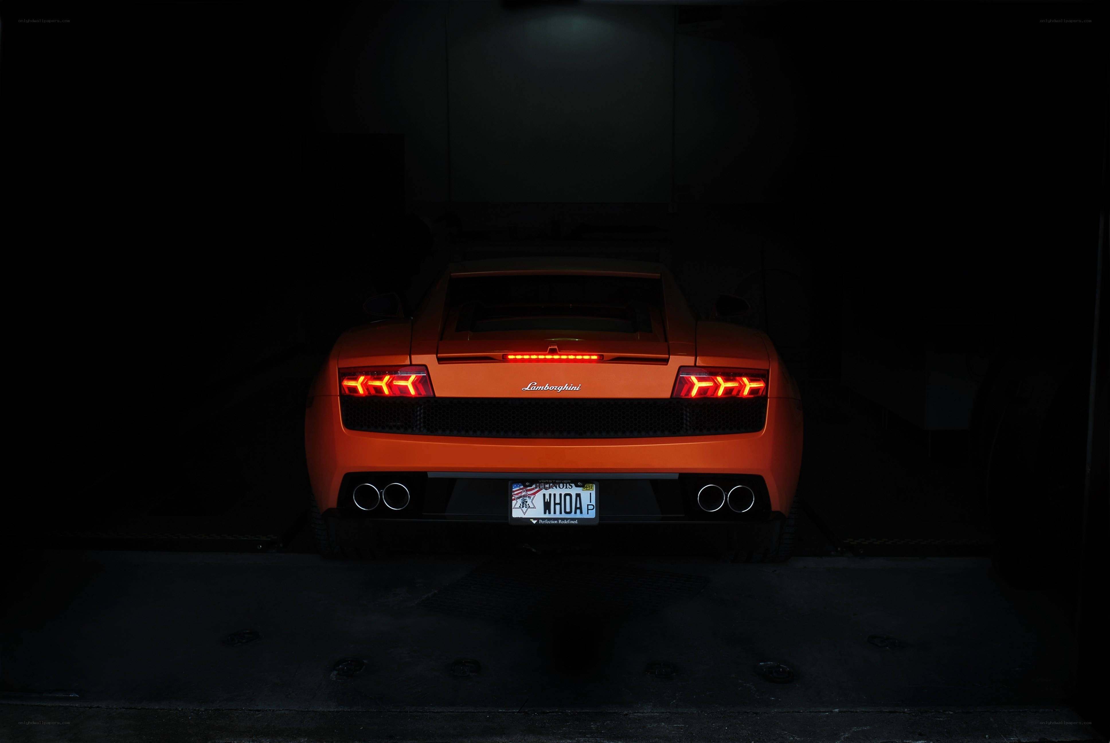 Orange Lamborghini in dark garage