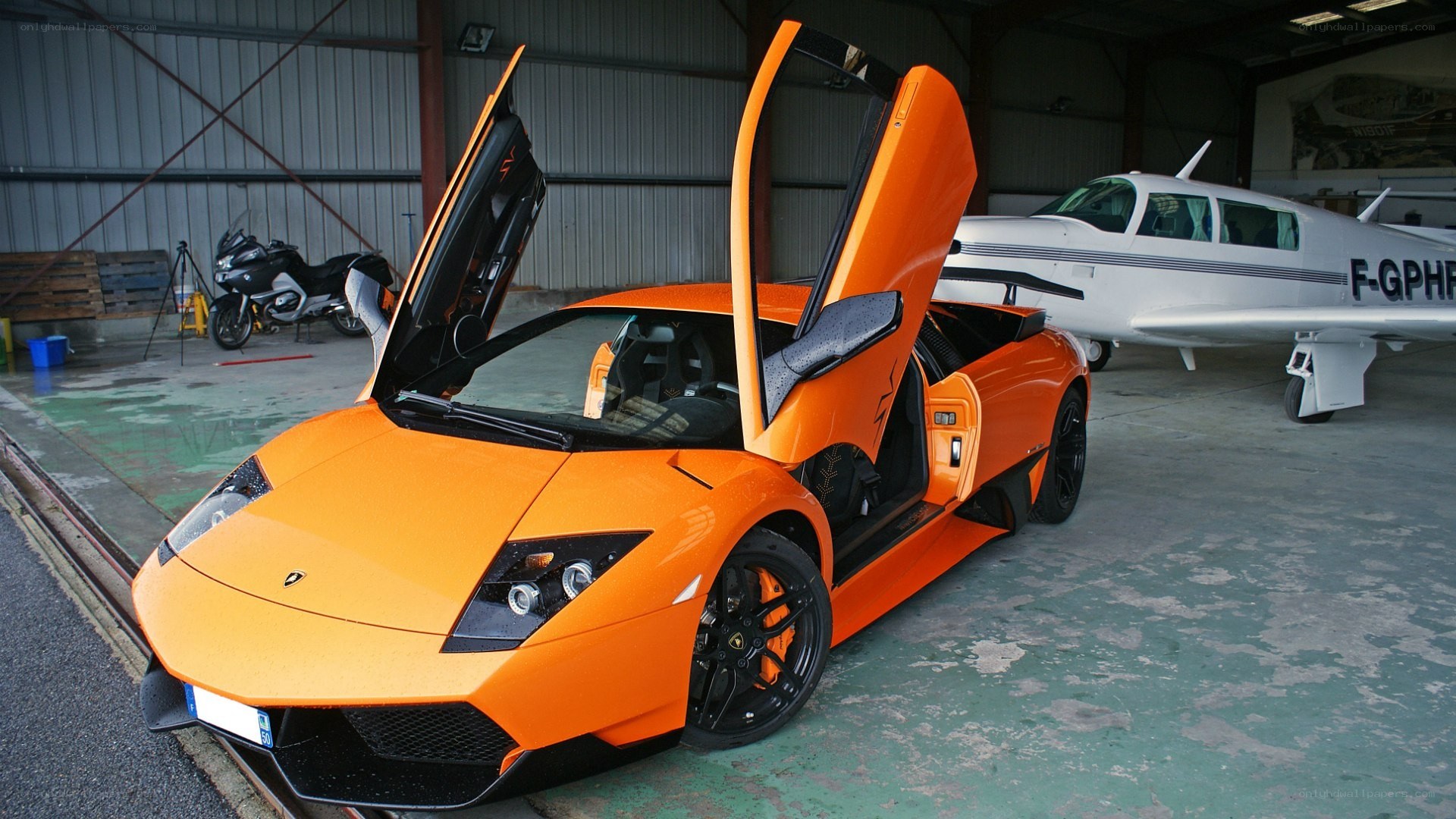 Orange Lamborghini in hangar