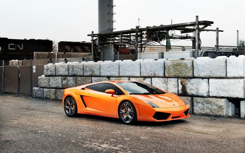 Orange Lamborghini in industrial area
