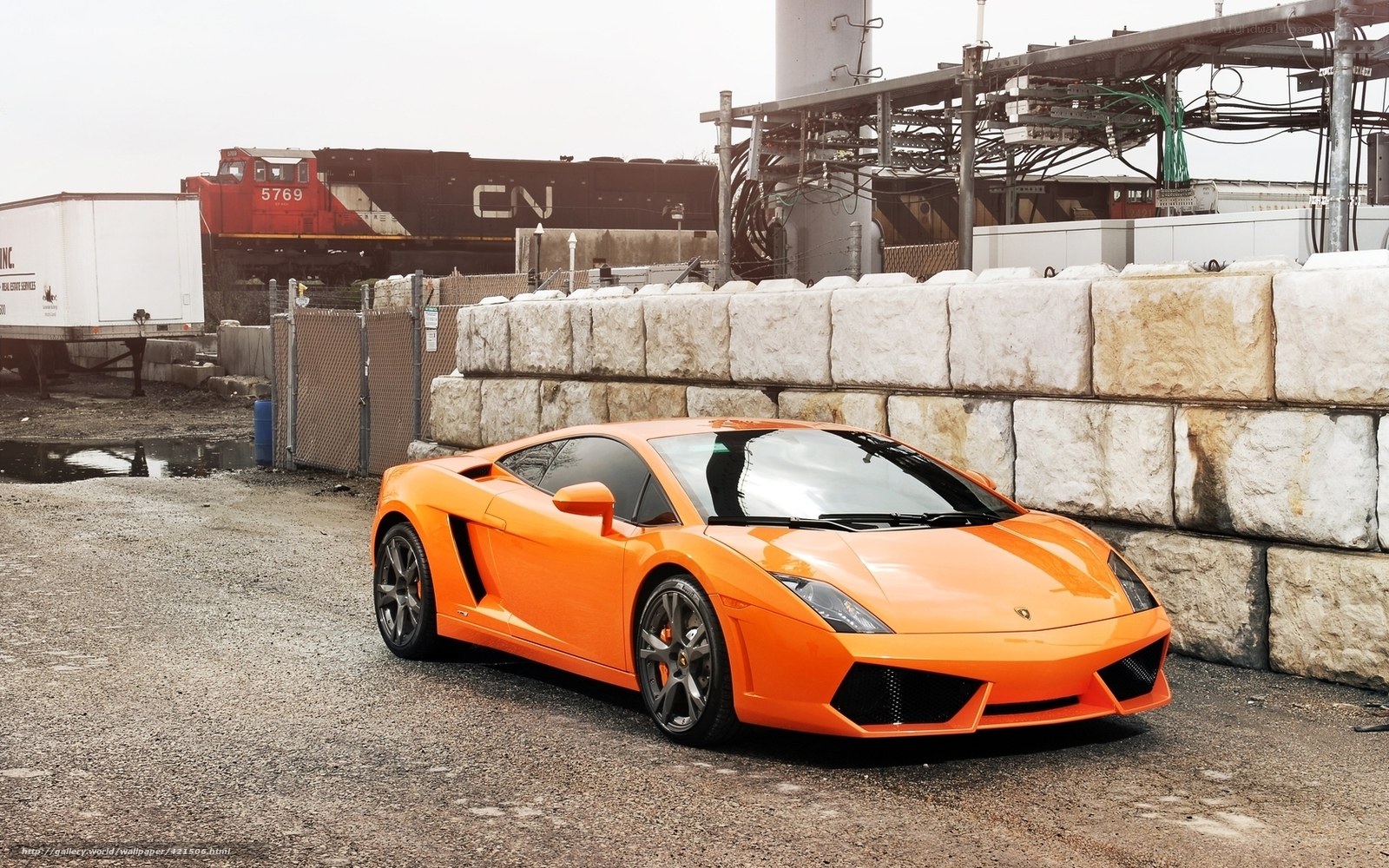 Orange Lamborghini in industrial area