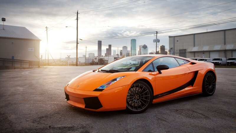 orange lamborghini in industrial lot