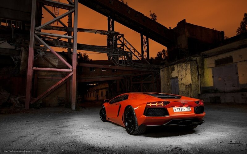 Orange Lamborghini in industrial setting