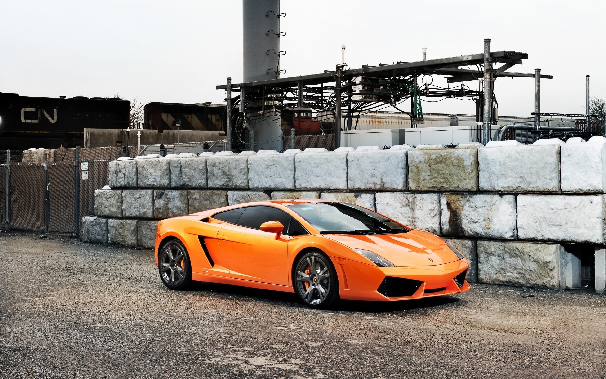 Orange Lamborghini in industrial setting