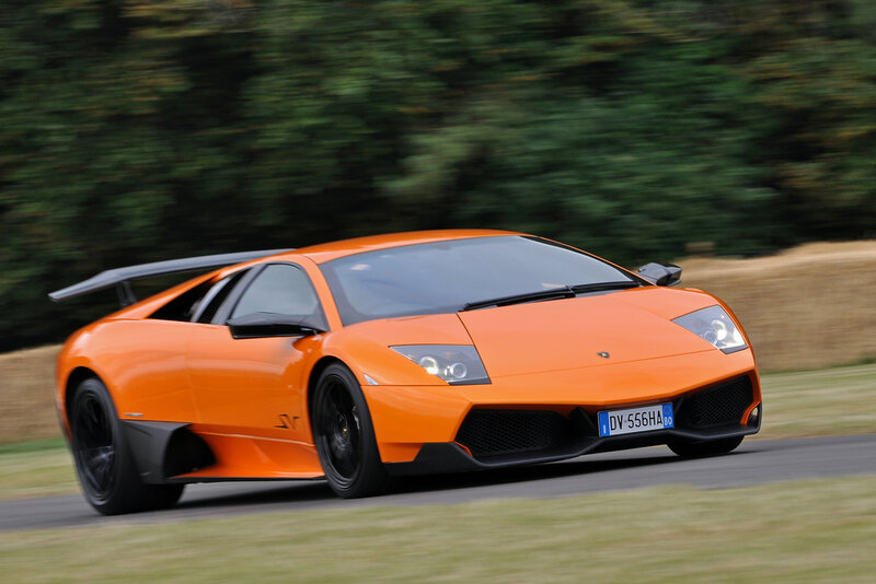 orange Lamborghini in motion
