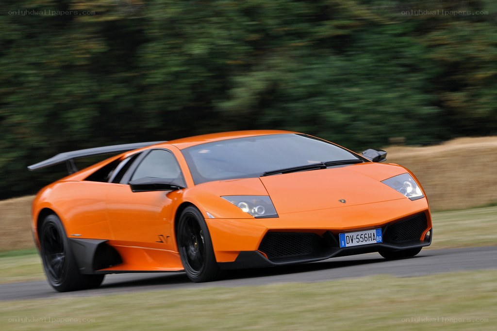 orange Lamborghini in motion