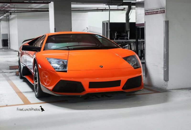 orange lamborghini in parking garage