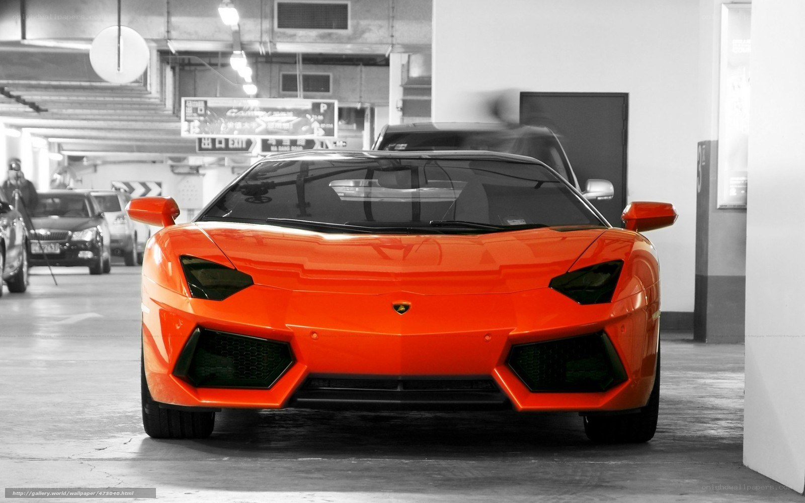 Orange Lamborghini in parking garage
