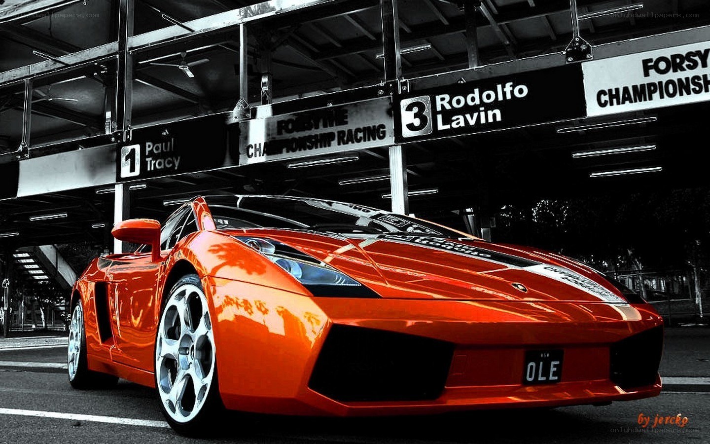 Orange Lamborghini in pit lane