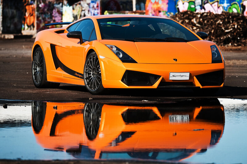 Orange Lamborghini in puddle