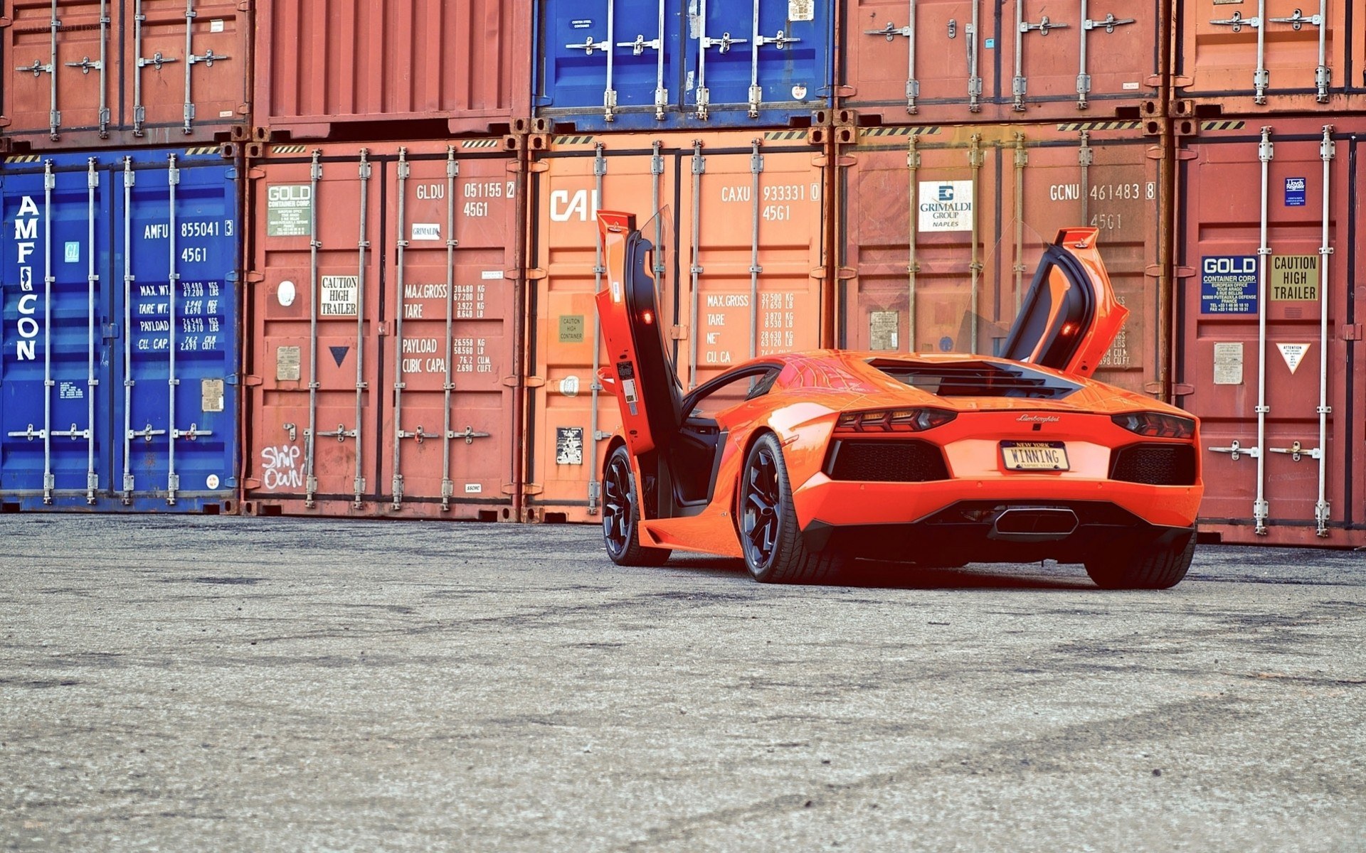 Orange Lamborghini in shipping yard
