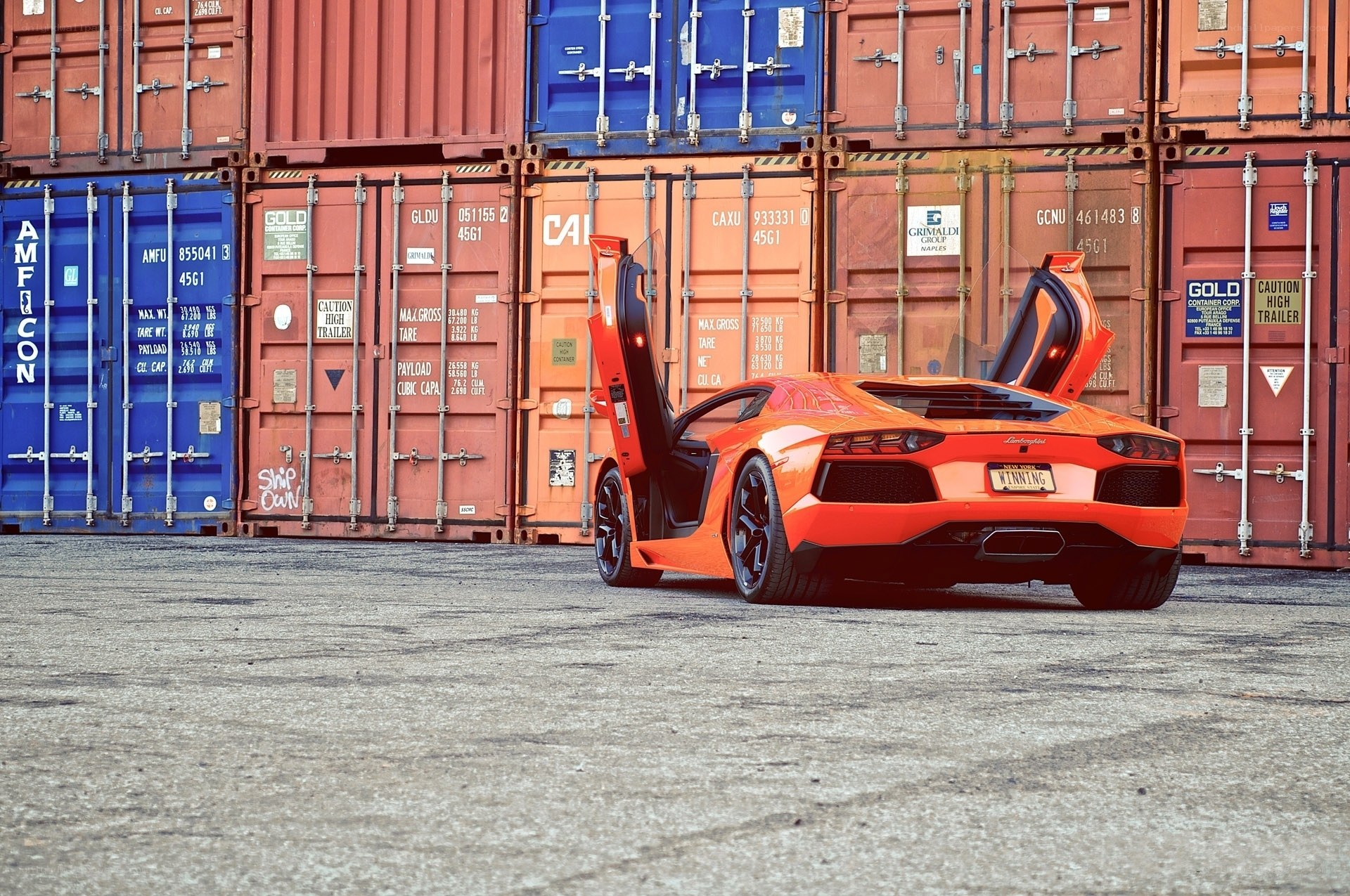 Orange Lamborghini in shipping yard