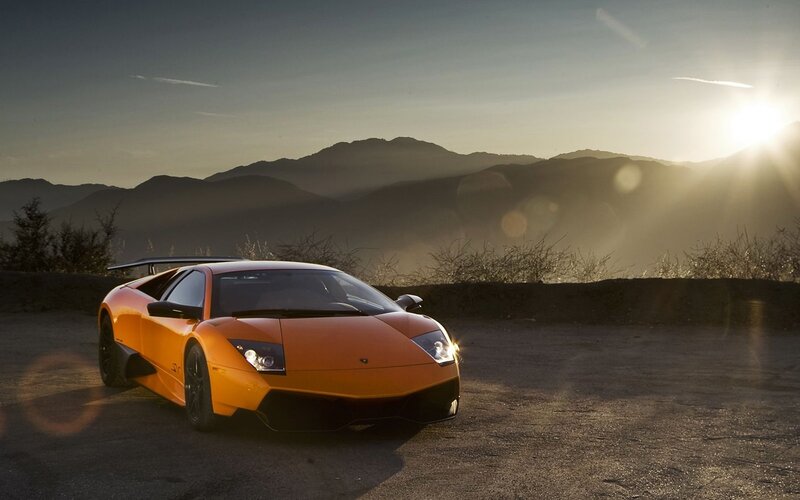 Orange Lamborghini in sunset