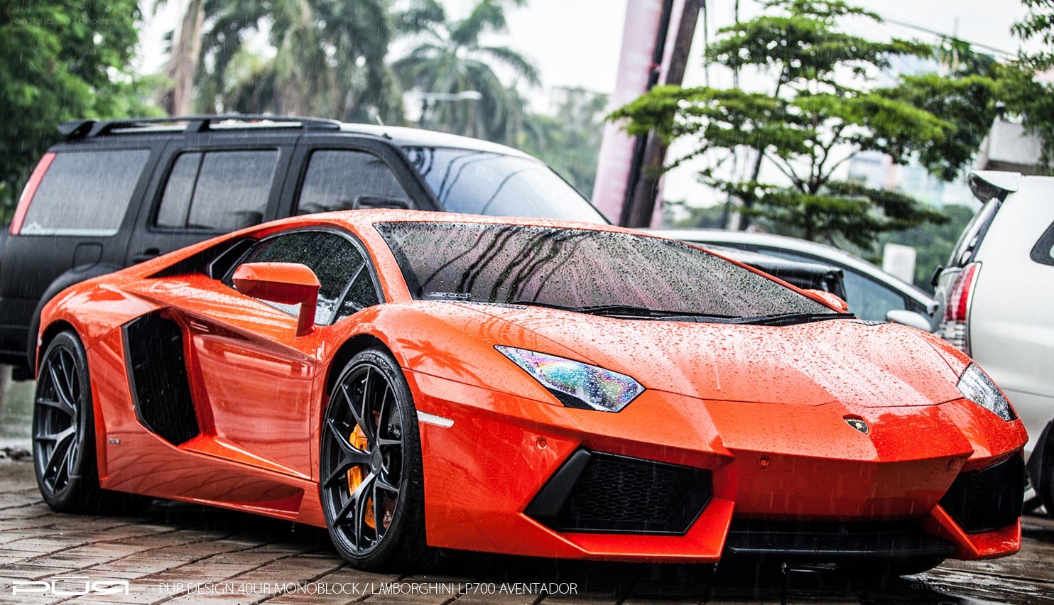 Orange Lamborghini in the rain