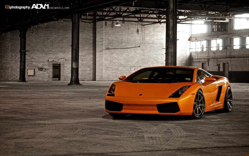 orange Lamborghini in warehouse