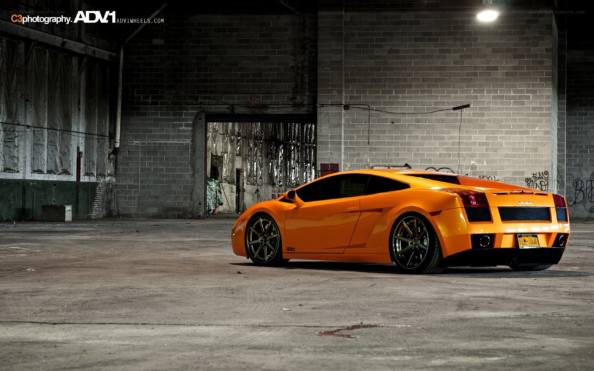 Orange Lamborghini in warehouse