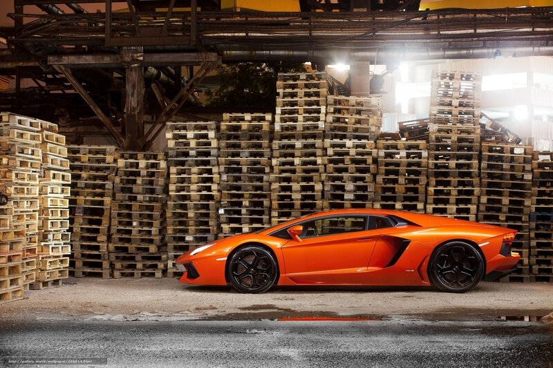 Orange Lamborghini in warehouse