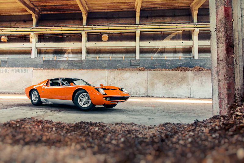 Orange Lamborghini Miura in warehouse