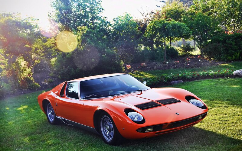 Orange Lamborghini Miura on lawn