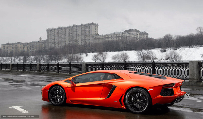 Orange Lamborghini on a bridge