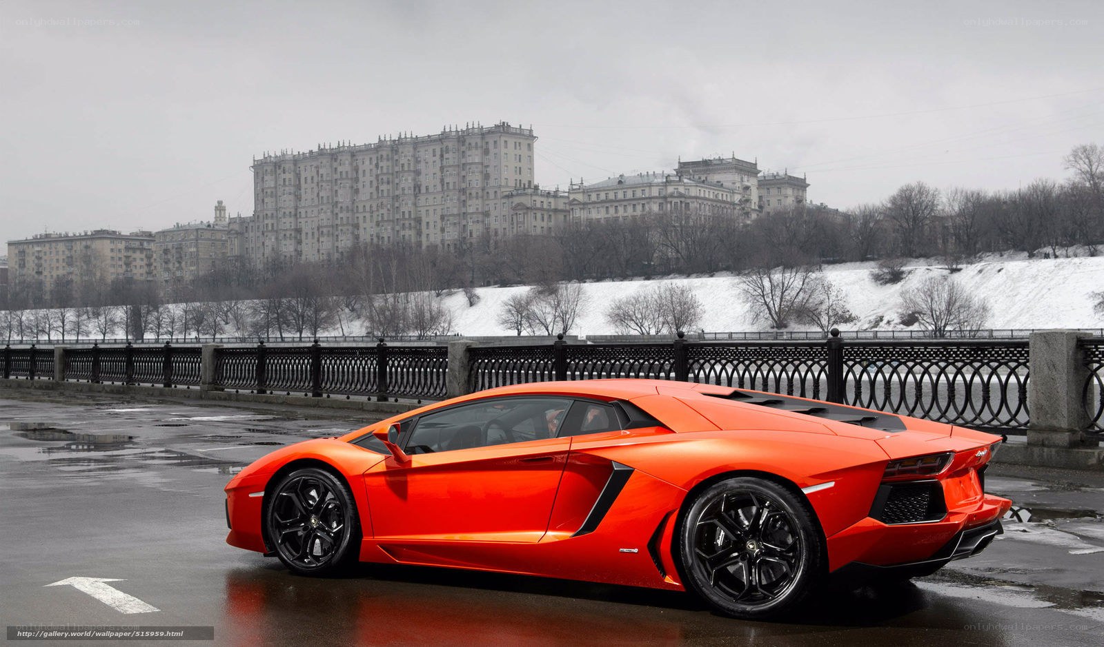 Orange Lamborghini on a bridge