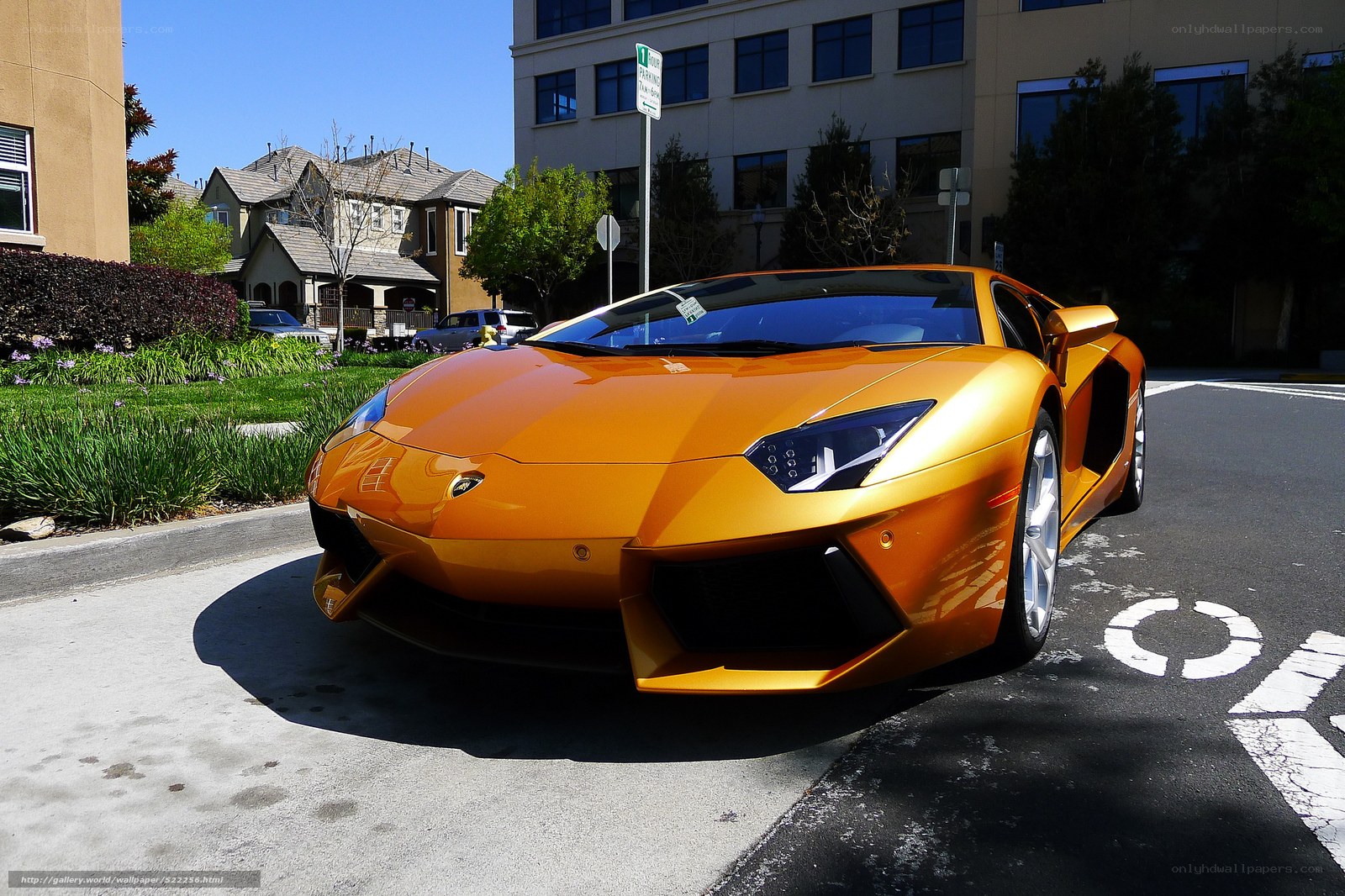 Orange Lamborghini on a city street