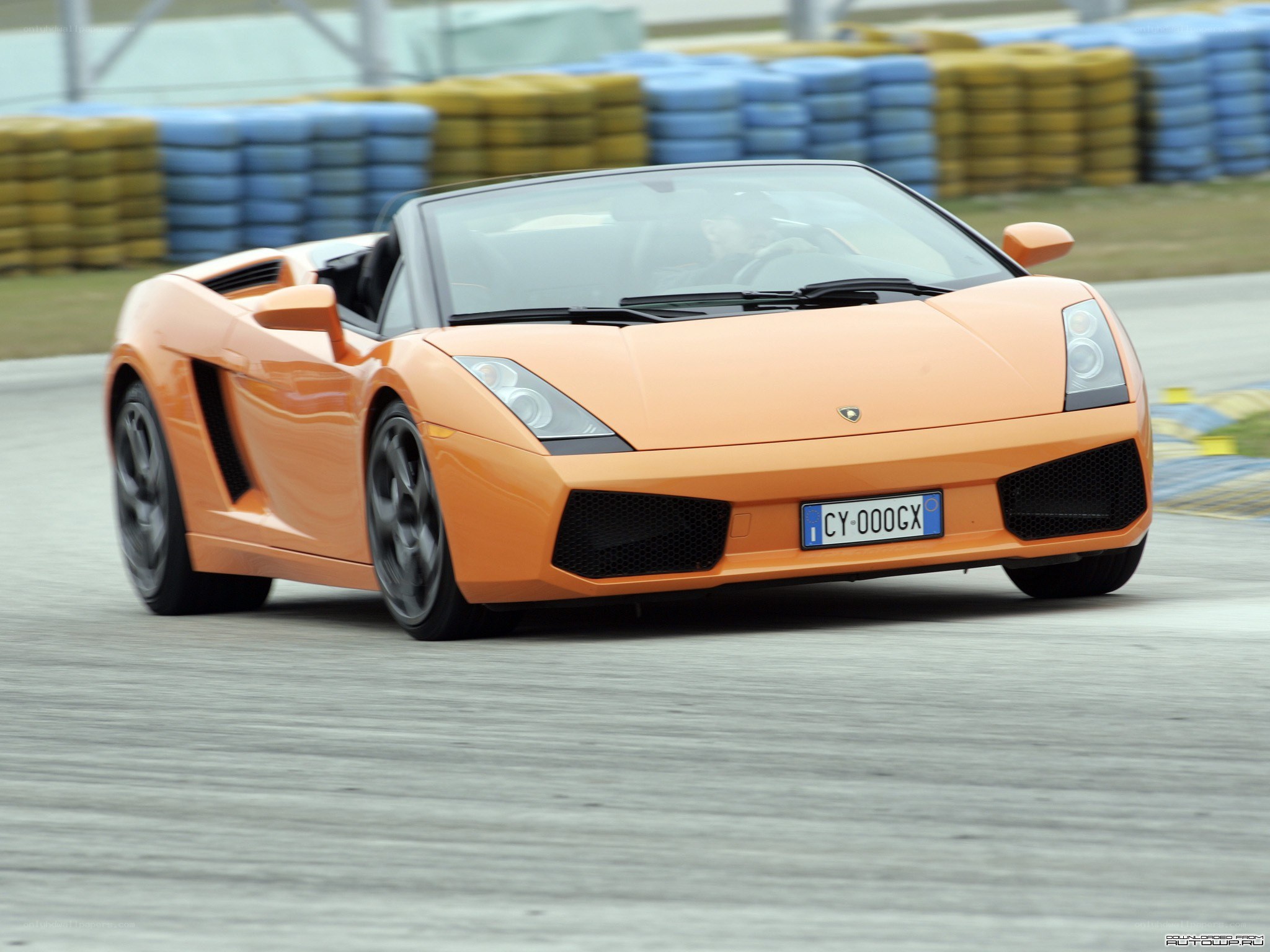 Orange Lamborghini on a racetrack