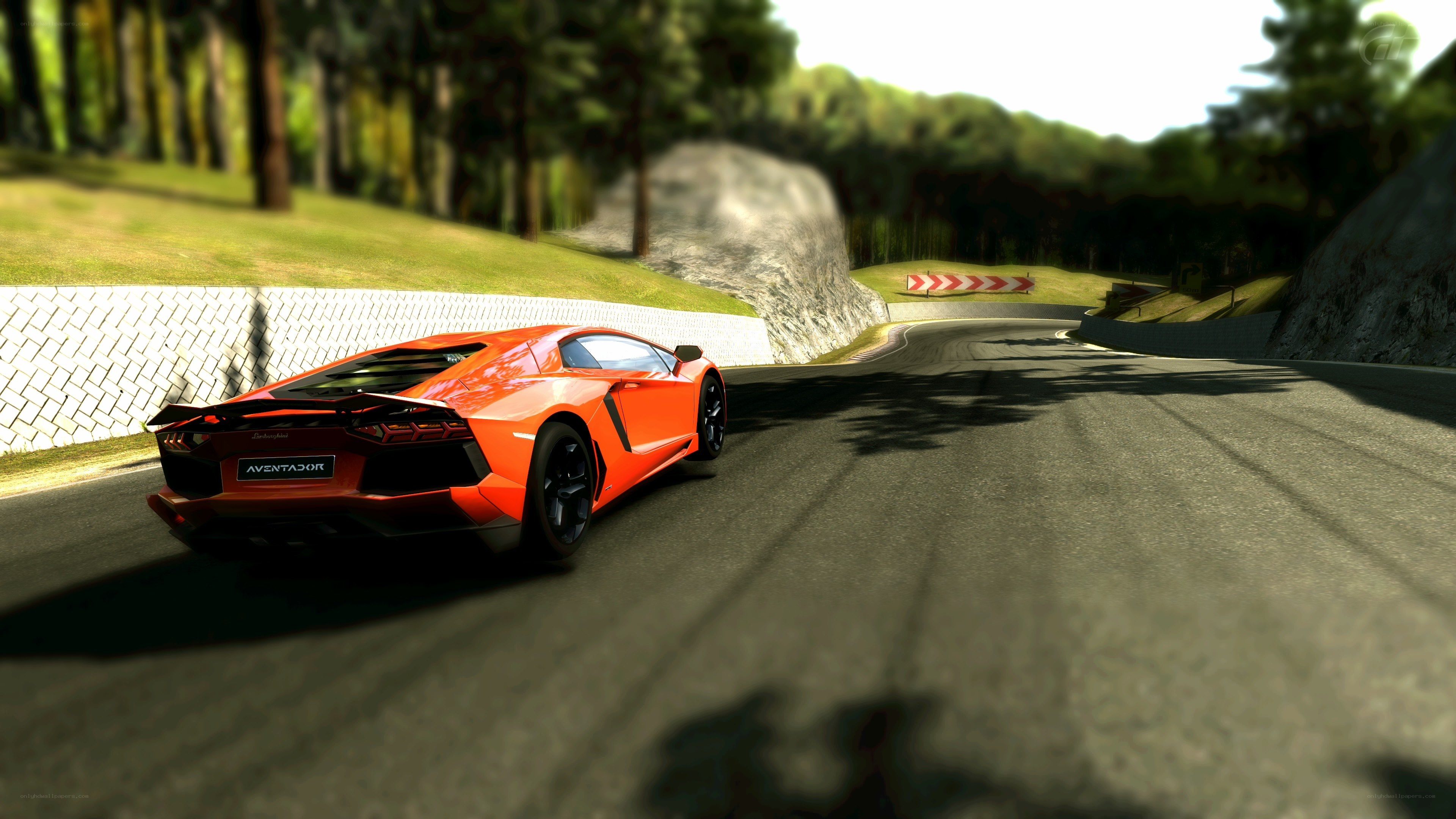 Orange Lamborghini on a racetrack